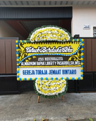 Papan Bunga Duka di Dewantara